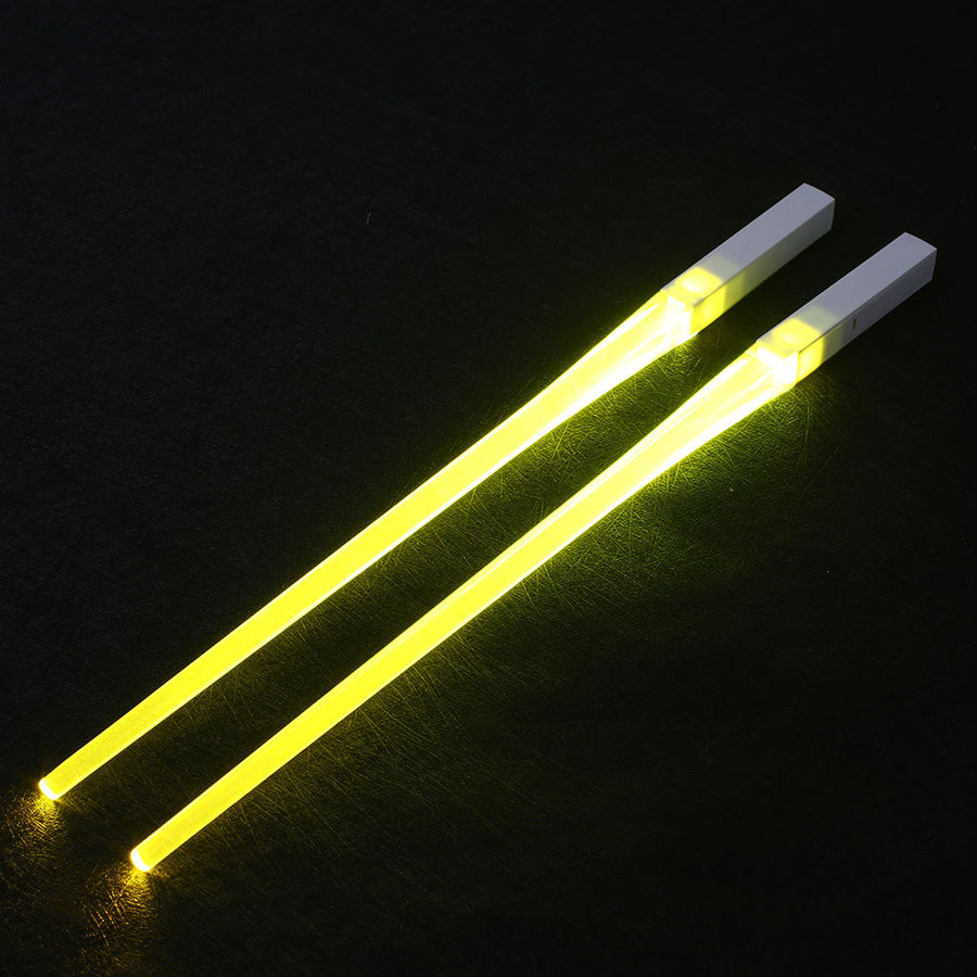 Pair of glowing chopsticks, featuring a sleek design with LED lights embedded in the handles, illuminating the entire length. Perfect for a fun, unique dining experience or themed events. Available in various colors, adding a vibrant touch to your sushi or asian meal.