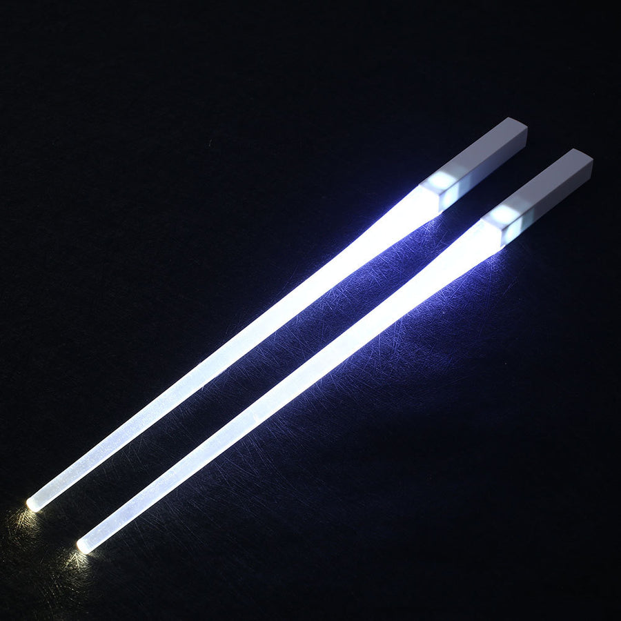 Pair of glowing chopsticks, featuring a sleek design with LED lights embedded in the handles, illuminating the entire length. Perfect for a fun, unique dining experience or themed events. Available in various colors, adding a vibrant touch to your sushi or asian meal.