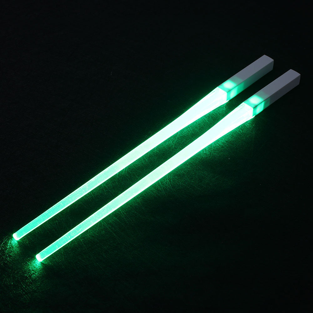 Pair of glowing chopsticks, featuring a sleek design with LED lights embedded in the handles, illuminating the entire length. Perfect for a fun, unique dining experience or themed events. Available in various colors, adding a vibrant touch to your sushi or asian meal.