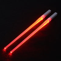 Pair of glowing chopsticks, featuring a sleek design with LED lights embedded in the handles, illuminating the entire length. Perfect for a fun, unique dining experience or themed events. Available in various colors, adding a vibrant touch to your sushi or asian meal.