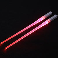 Pair of glowing chopsticks, featuring a sleek design with LED lights embedded in the handles, illuminating the entire length. Perfect for a fun, unique dining experience or themed events. Available in various colors, adding a vibrant touch to your sushi or asian meal.