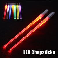 Pair of glowing chopsticks, featuring a sleek design with LED lights embedded in the handles, illuminating the entire length. Perfect for a fun, unique dining experience or themed events. Available in various colors, adding a vibrant touch to your sushi or asian meal.