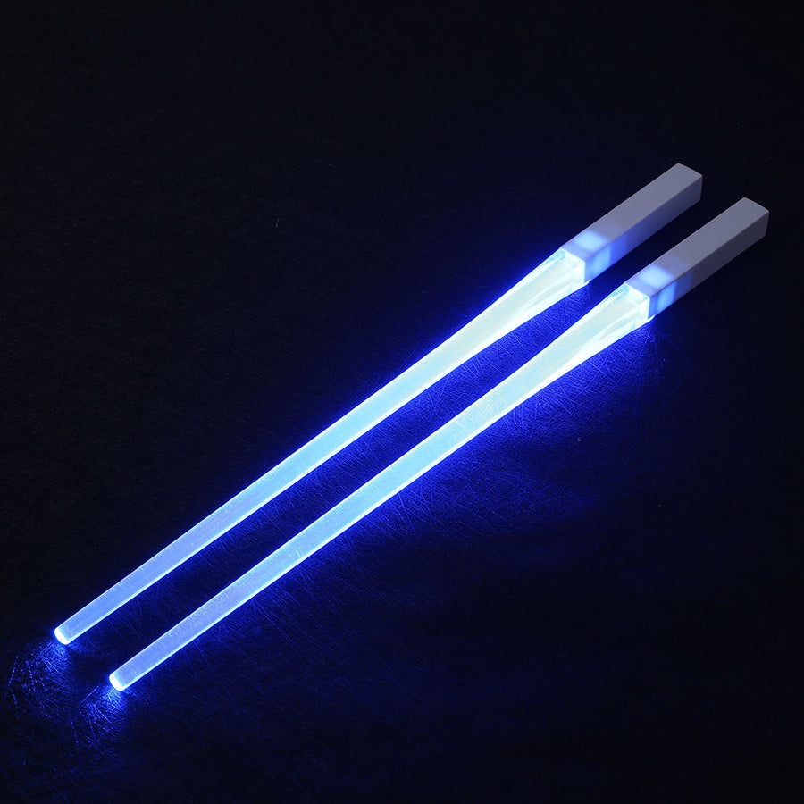 Pair of glowing chopsticks, featuring a sleek design with LED lights embedded in the handles, illuminating the entire length. Perfect for a fun, unique dining experience or themed events. Available in various colors, adding a vibrant touch to your sushi or asian meal.